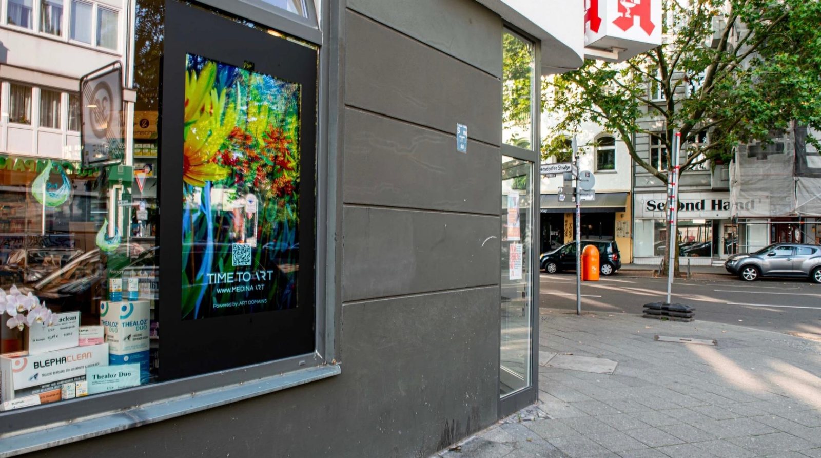 .art campaign on a street-level digital screen in Berlin