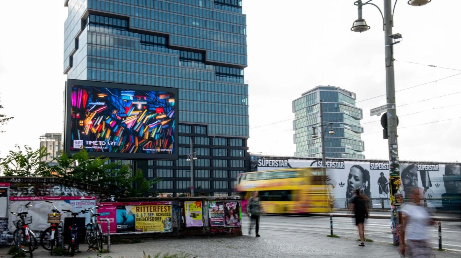 .art on a large-format tower billboard in Berlin