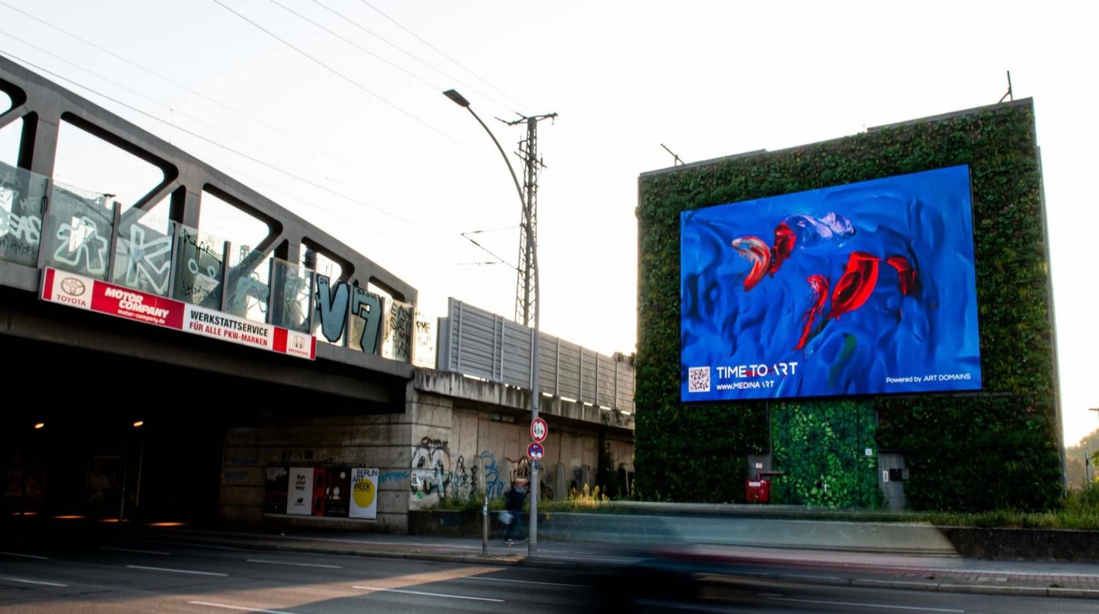 .art billboard set against a green wall